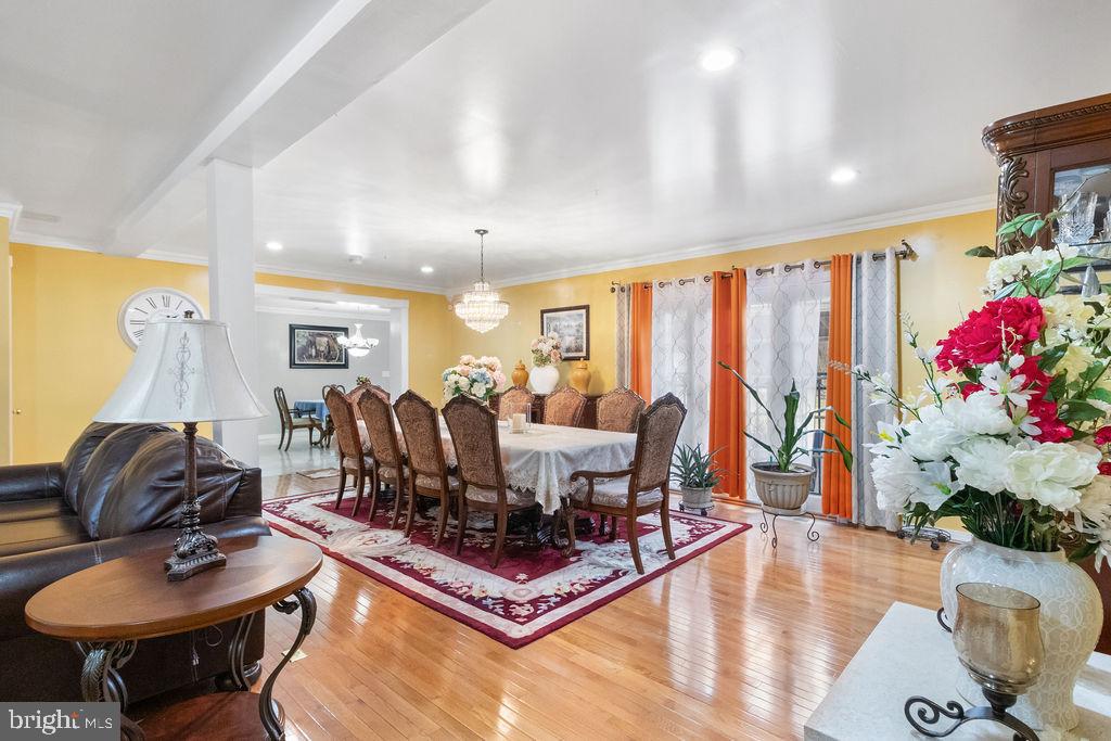 607 Valley Brook Drive Silver Spring, MD 20904 - Photo 5 of 67 a living room with furniture a rug and white walls