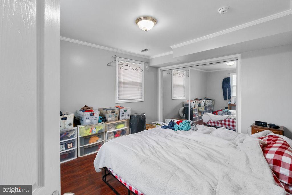 607 Valley Brook Drive Silver Spring, MD 20904 - Photo 53 of 67 a bedroom with a bed and a bookshelf