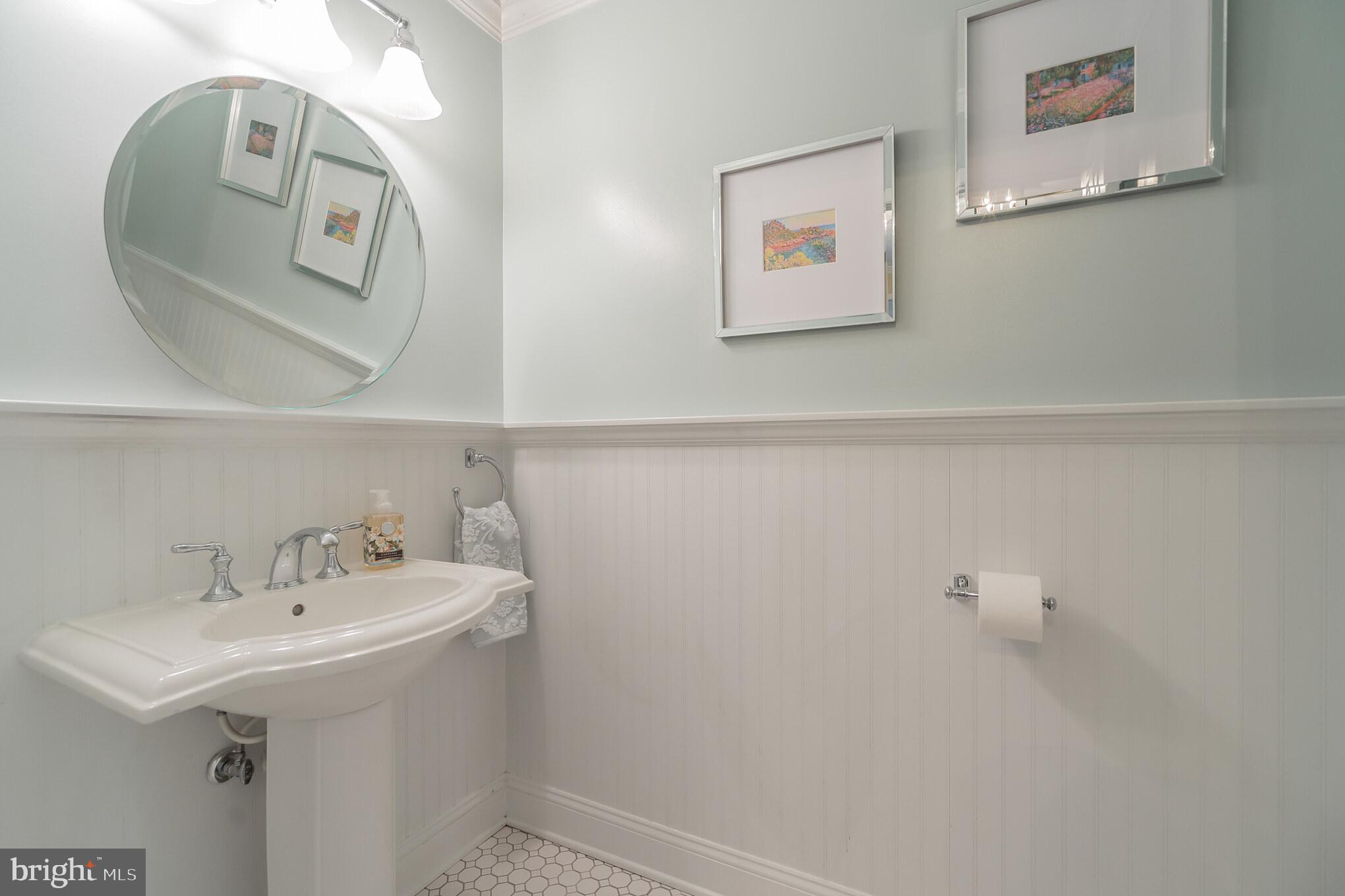 910 Riva Ridge Drive Great Falls, VA 22066 - Photo 13 of 49 Powder Room w/Wainscoting & Detailed Trimwork