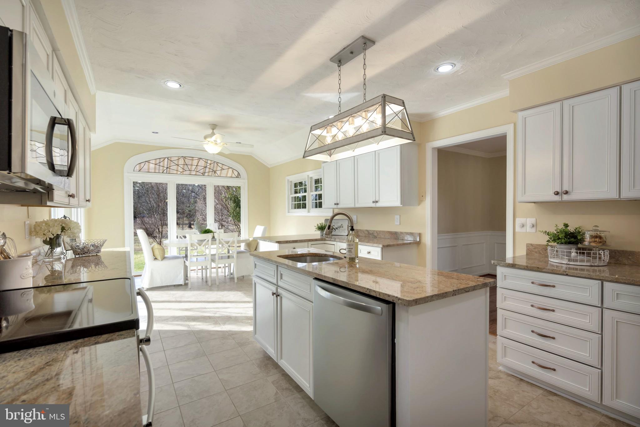 910 Riva Ridge Drive Great Falls, VA 22066 - Photo 5 of 49 Updated Kitchen w/Fresh White Cabinetry & Island