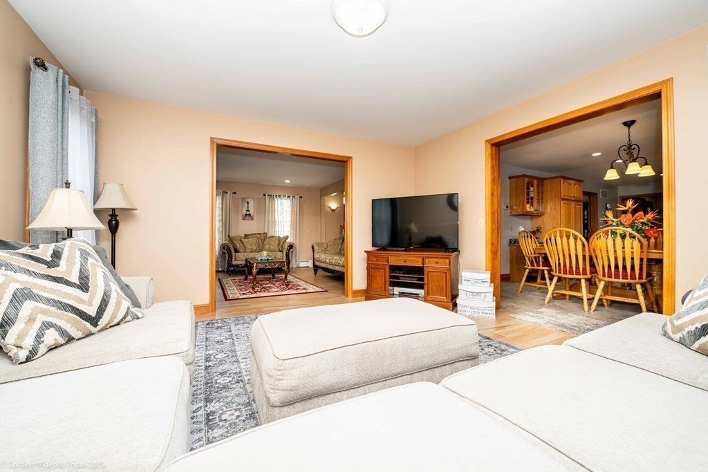 27 Peach Blossom Road Acushnet, MA 02743 - Photo 11 of 42 a living room with furniture and a flat screen tv