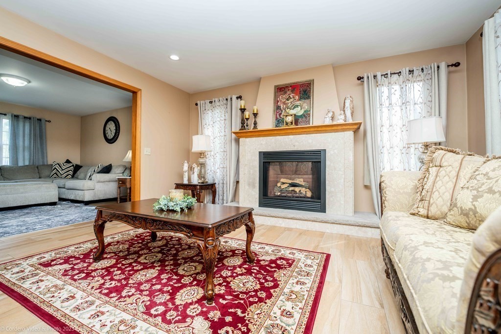 27 Peach Blossom Road Acushnet, MA 02743 - Photo 13 of 42 a living room with furniture and a fireplace