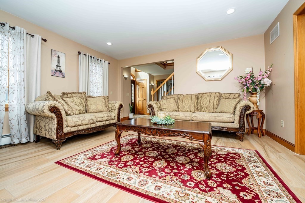27 Peach Blossom Road Acushnet, MA 02743 - Photo 14 of 42 a living room with furniture and a rug