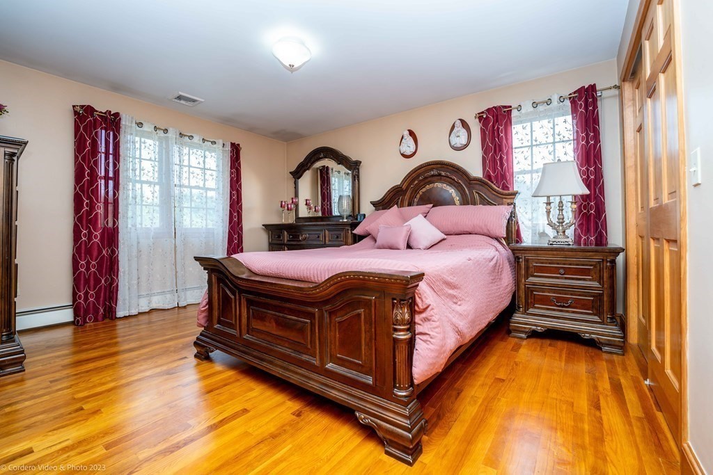 27 Peach Blossom Road Acushnet, MA 02743 - Photo 19 of 42 a bedroom with a bed and a window