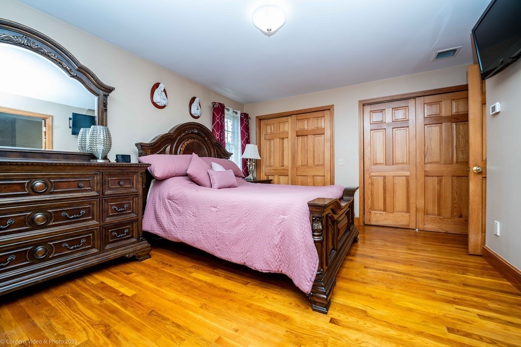 27 Peach Blossom Road Acushnet, MA 02743 - Photo 20 of 42 a spacious bedroom with a bed and a window