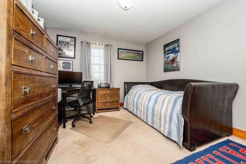 27 Peach Blossom Road Acushnet, MA 02743 - Photo 21 of 42 a bedroom with a bed and furniture