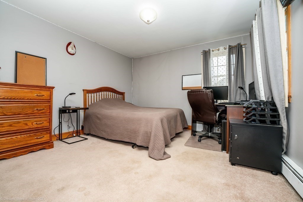 27 Peach Blossom Road Acushnet, MA 02743 - Photo 22 of 42 a bedroom with furniture and a window