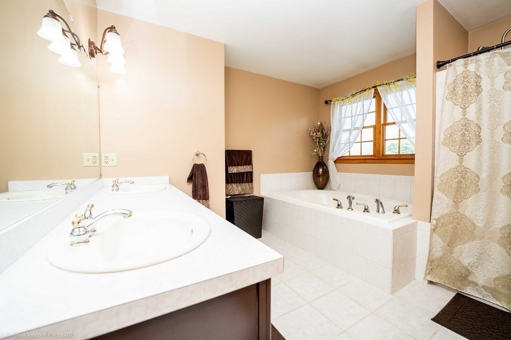 27 Peach Blossom Road Acushnet, MA 02743 - Photo 26 of 42 a bathroom with a sink and a bathtub