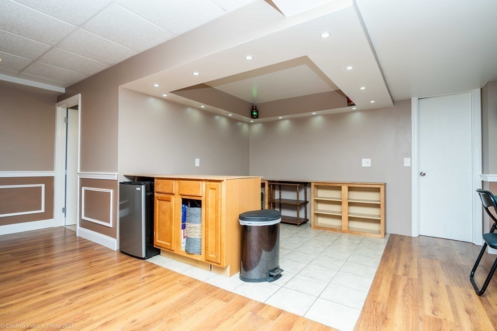 27 Peach Blossom Road Acushnet, MA 02743 - Photo 32 of 42 an empty room with wooden floor and windows