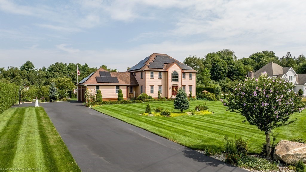 27 Peach Blossom Road Acushnet, MA 02743 - Photo 33 of 42 a front view of a house with a yard