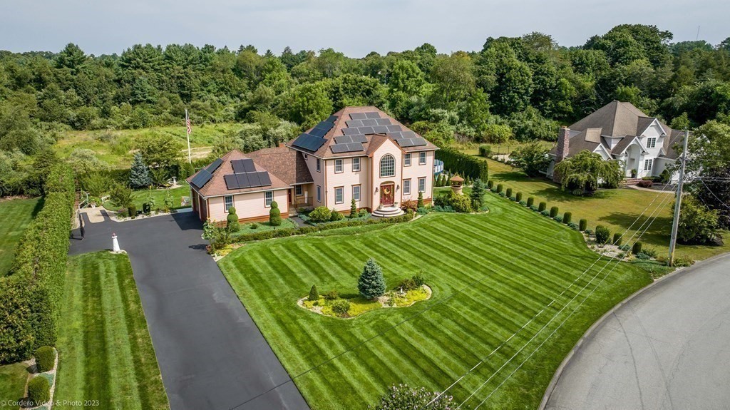 27 Peach Blossom Road Acushnet, MA 02743 - Photo 34 of 42 a front view of a house with a garden