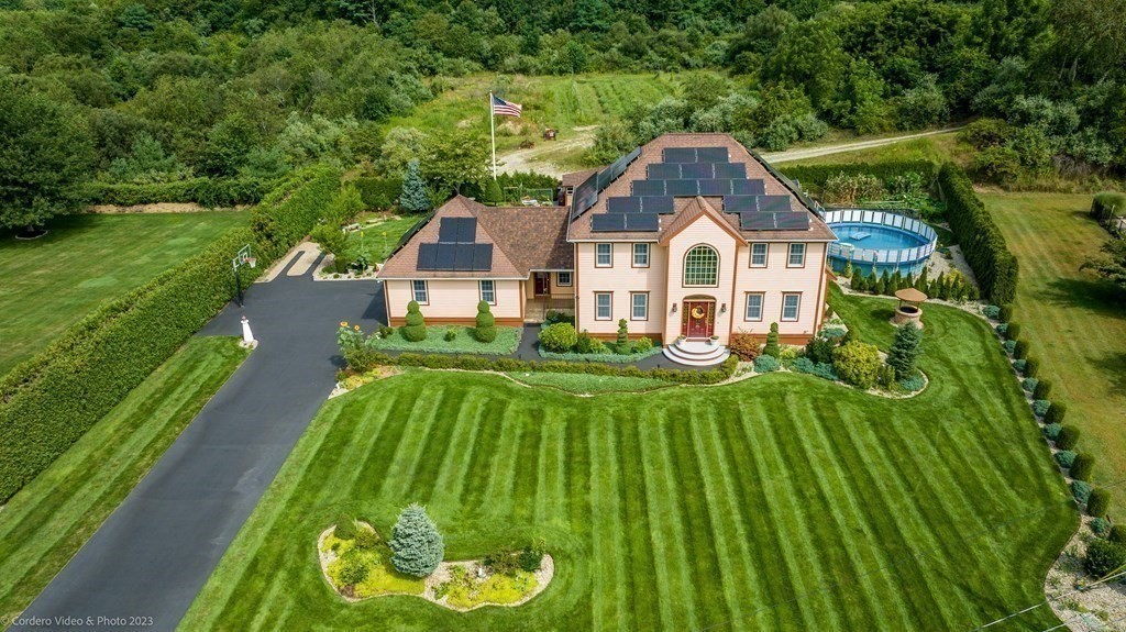 27 Peach Blossom Road Acushnet, MA 02743 - Photo 35 of 42 a front view of a house with a yard