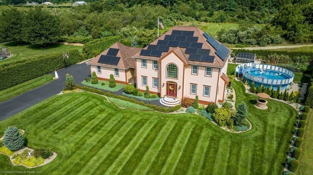 27 Peach Blossom Road Acushnet, MA 02743 - Photo 36 of 42 a aerial view of a house with swimming pool next to a big yard