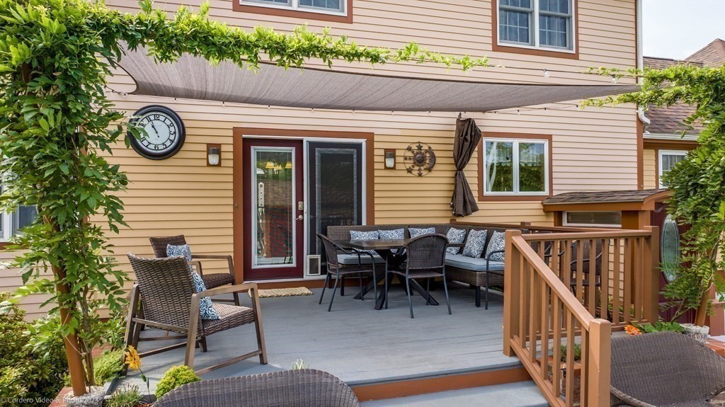 27 Peach Blossom Road Acushnet, MA 02743 - Photo 40 of 42 a view of a house with a chairs and table in a patio