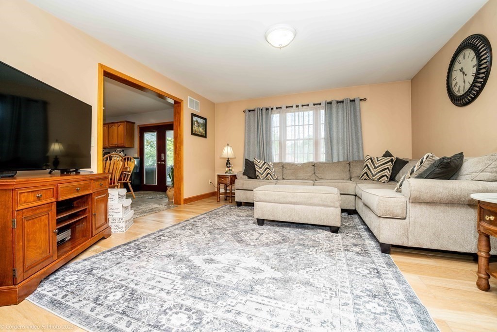 27 Peach Blossom Road Acushnet, MA 02743 - Photo 9 of 42 a living room with furniture and a flat screen tv