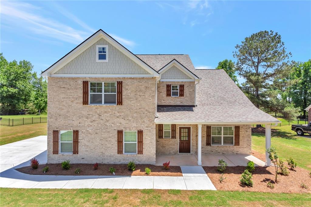 a front view of a house with yard