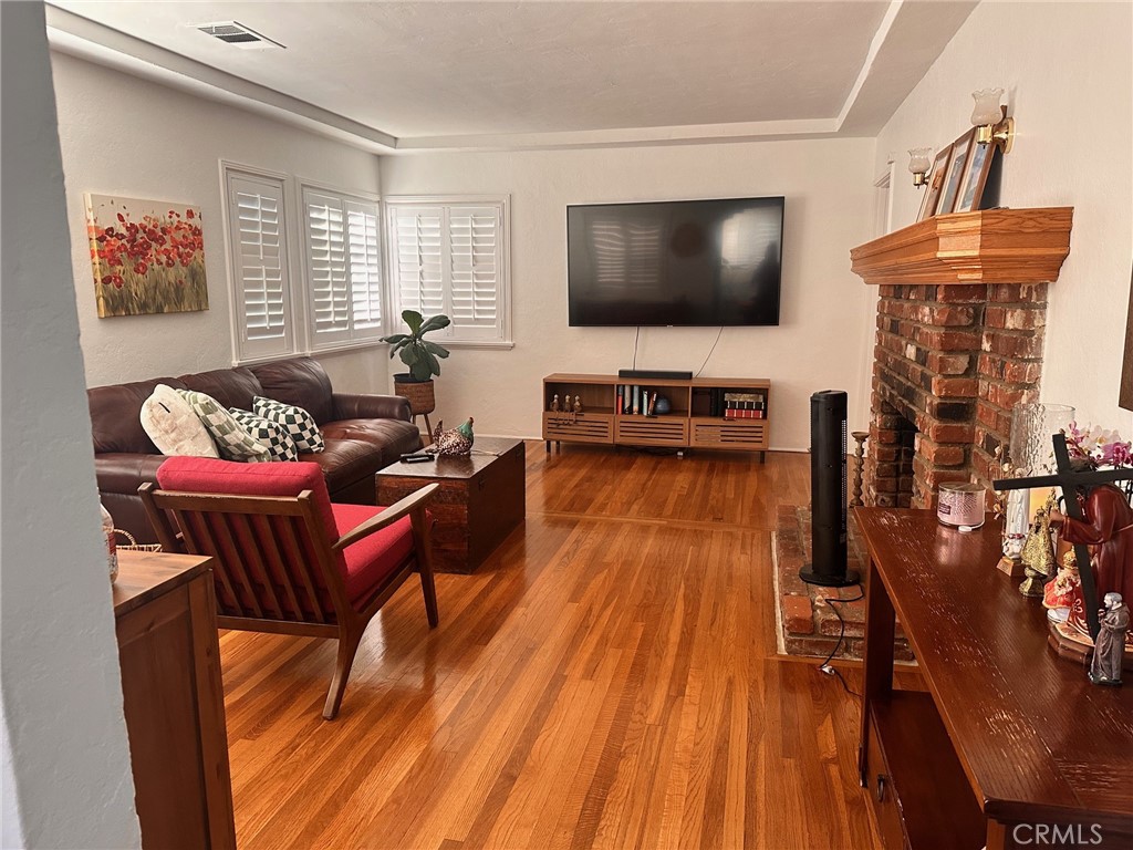 18090 Iris Avenue Riverside, CA 92508 - Photo 11 of 49 a living room with furniture and a flat screen tv