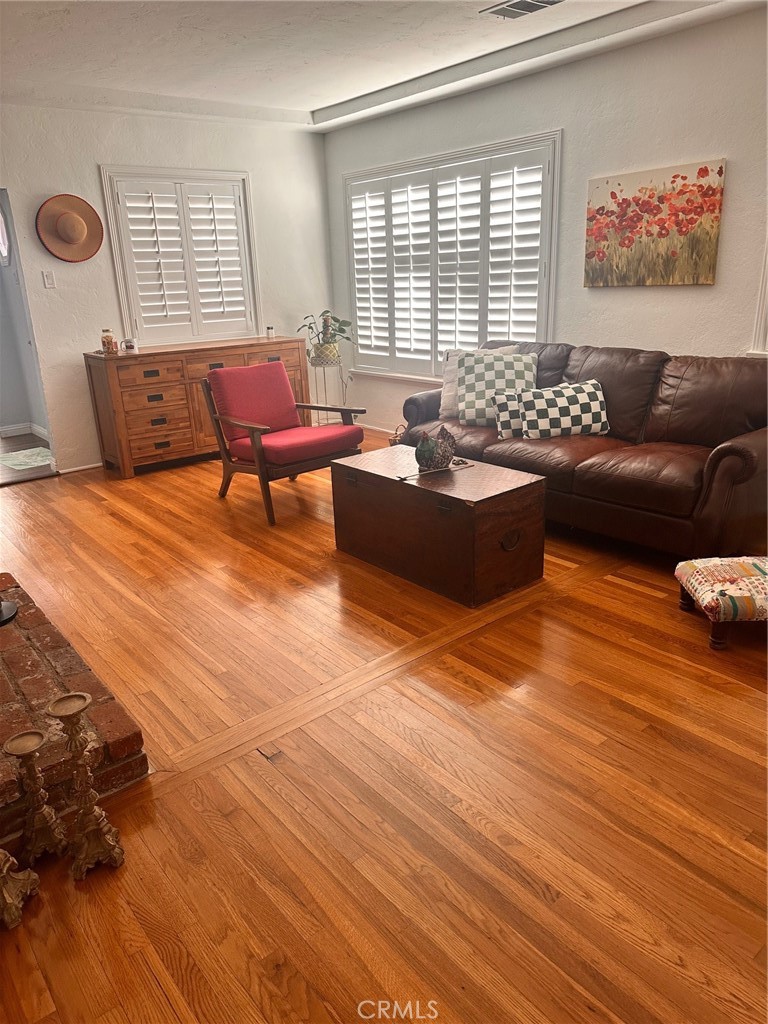 18090 Iris Avenue Riverside, CA 92508 - Photo 12 of 49 a living room with furniture and wooden floor