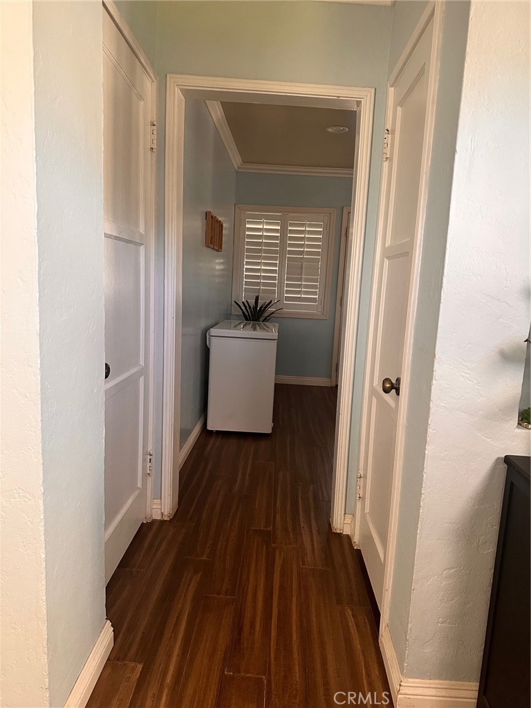 18090 Iris Avenue Riverside, CA 92508 - Photo 18 of 49 a view of a hallway with wooden floor and staircase