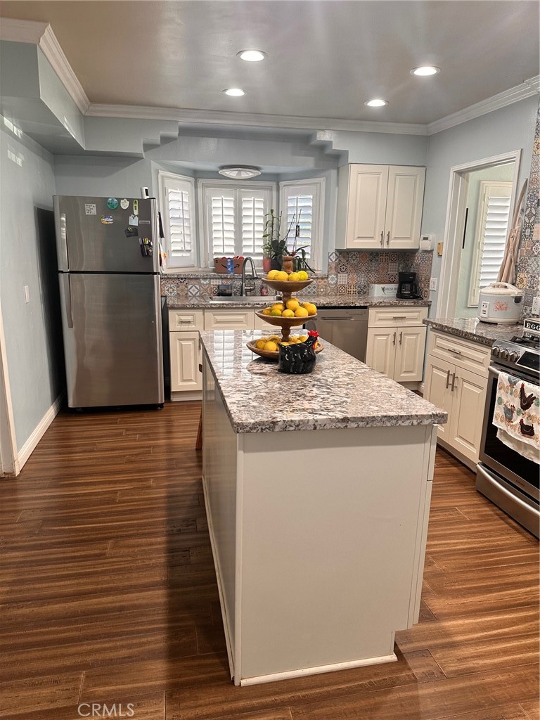 18090 Iris Avenue Riverside, CA 92508 - Photo 21 of 49 a kitchen with stainless steel appliances granite countertop a refrigerator a stove top oven a sink and a refrigerator