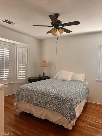 a bed room with a bed and a window