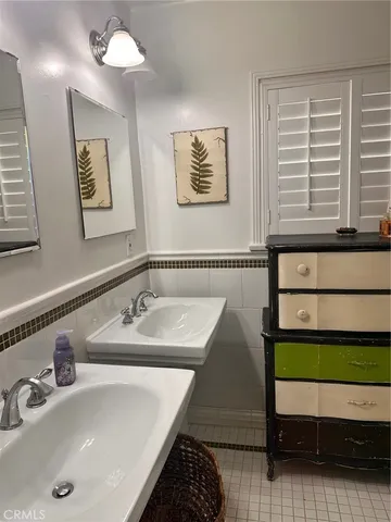 a bathroom with a shower curtain and a sink