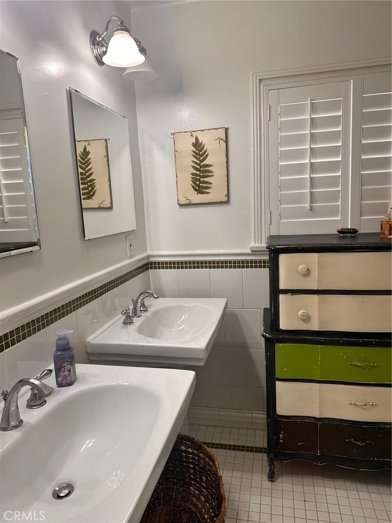 18090 Iris Avenue Riverside, CA 92508 - Photo 26 of 49 a bathroom with a sink and a mirror