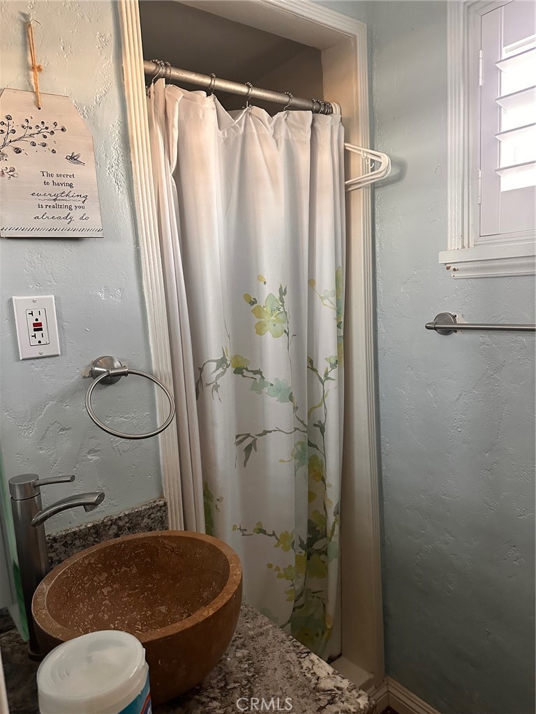 18090 Iris Avenue Riverside, CA 92508 - Photo 28 of 49 a bathroom with a toilet and a shower