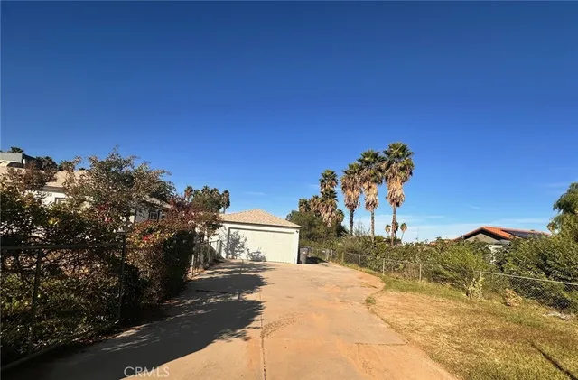 a view of a backyard of a house