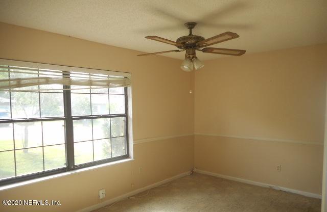411 Gentian Road St. Augustine, FL 32086 - Photo 4 of 6 an empty room with a window