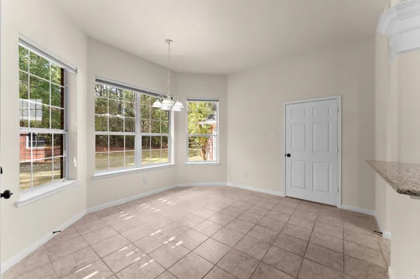 a hallway with a sink and cabinets