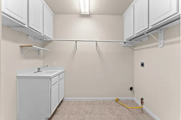 a spacious bedroom with a large bed and a flat screen tv