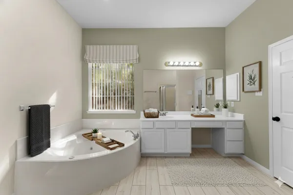 a bathroom with a bathtub and sink