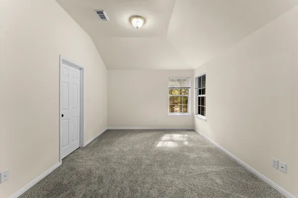 a view of a house with wooden deck