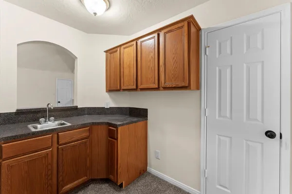 a view of a balcony with wooden floor and fence
