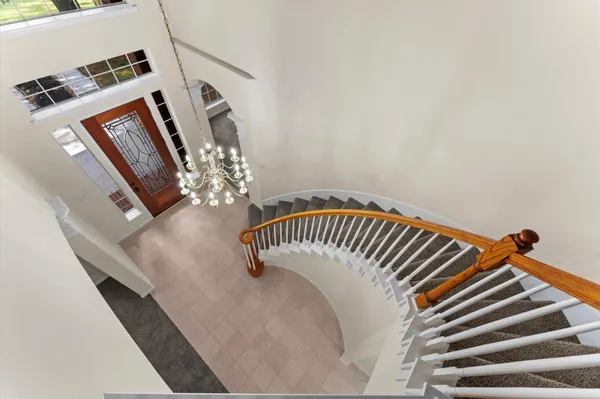 an aerial view of a house with a yard and garden