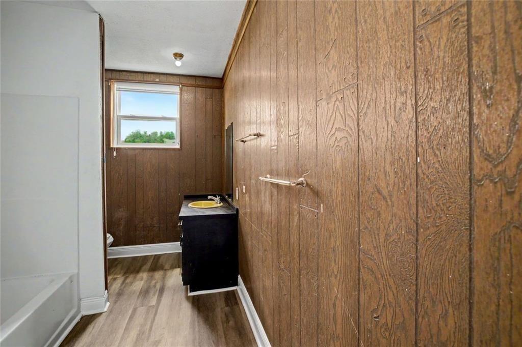 1605 Shackelford Road Griffin, GA 30224 - Photo 32 of 51 a view of a hallway with wooden floor