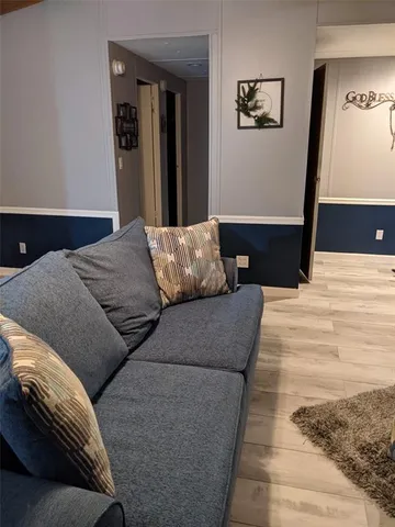 a bedroom with a bed and wall painting