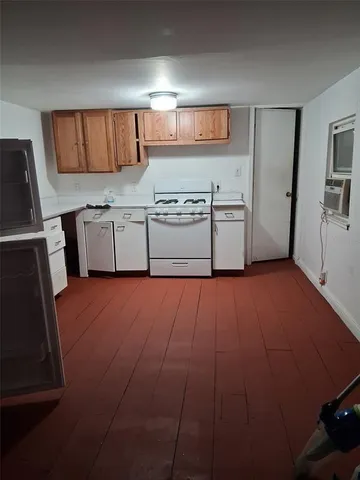 a kitchen with stainless steel appliances a refrigerator and a stove top oven