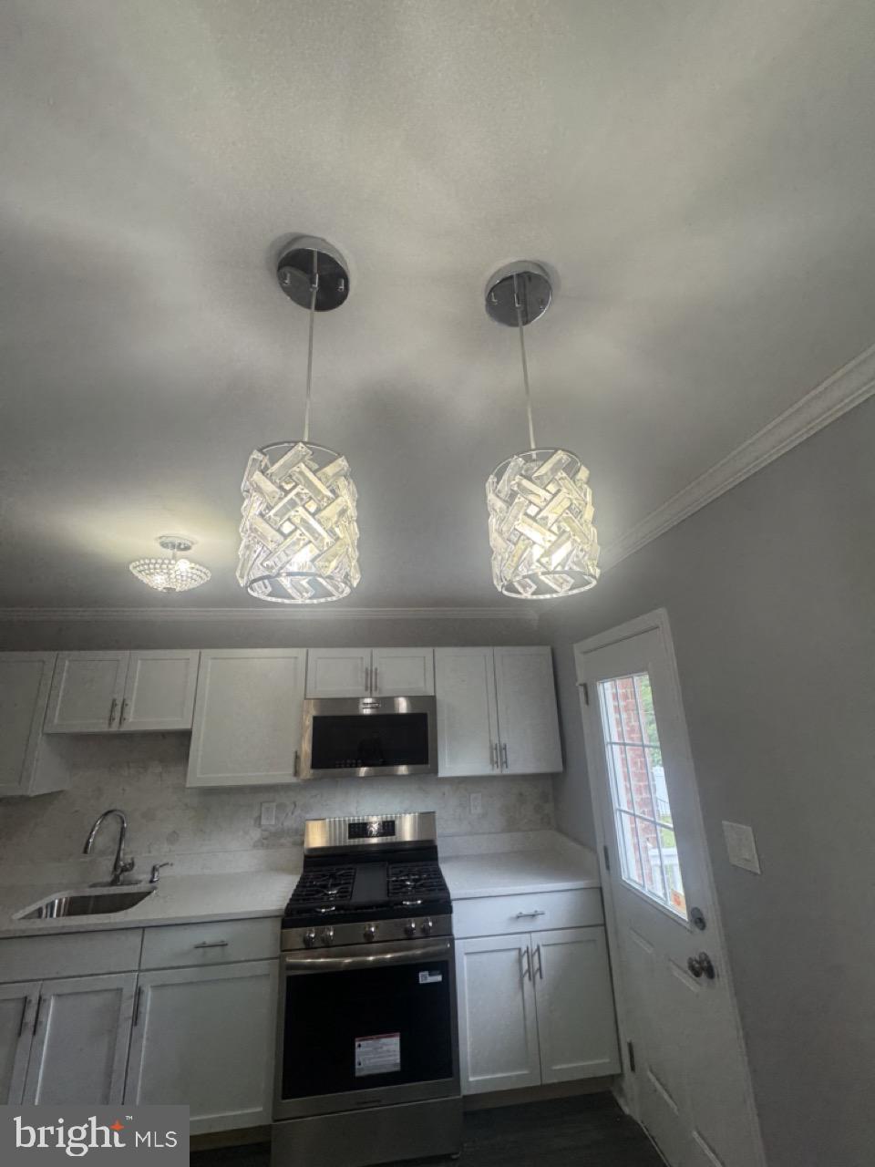 5626 Whitby Road Baltimore, MD 21206 - Photo 32 of 33 Modern kitchen with stylish lighting.
