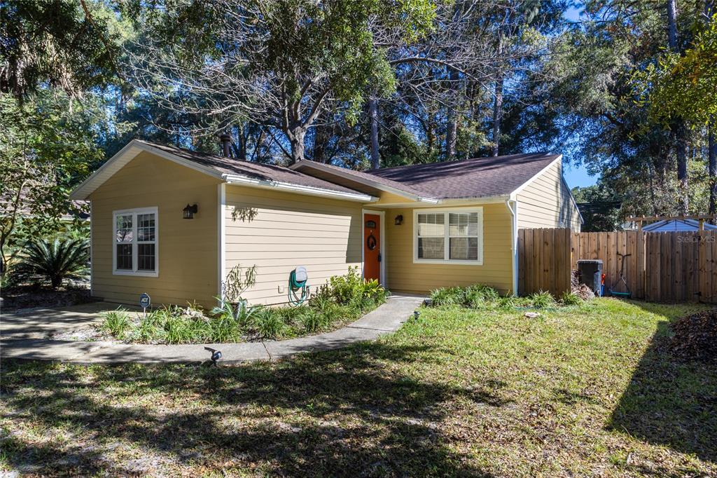 2045 Southwest 73rd Terrace Gainesville, FL 32607 - Photo 1 of 1 a front view of a house with garden