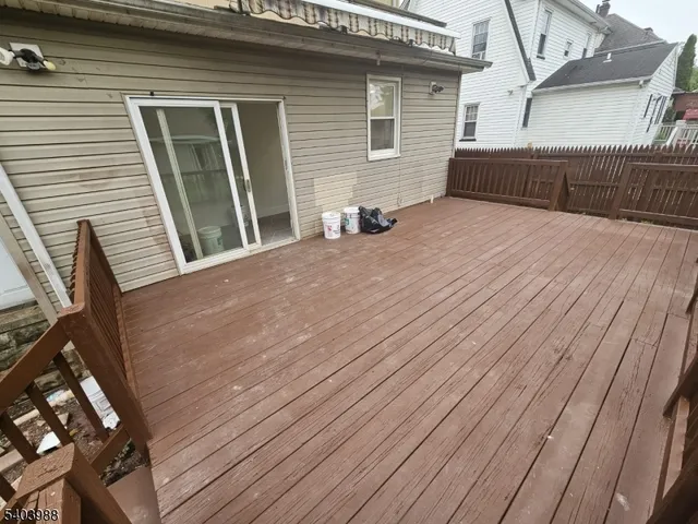 a view of a house with wooden deck