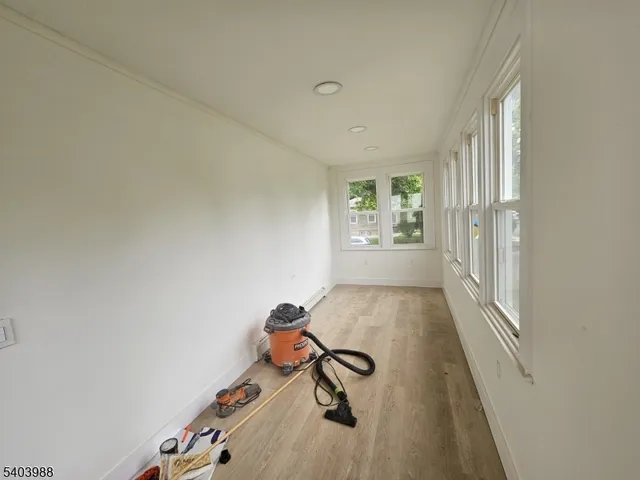 a view of a room with gym equipment and a window