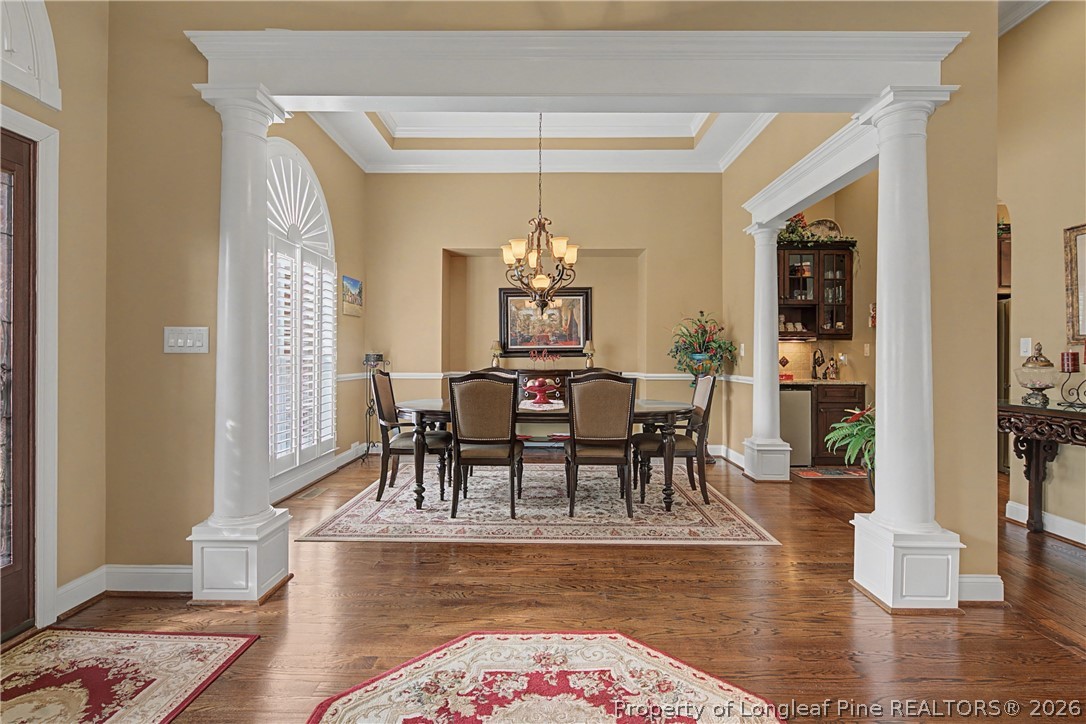 115 Micahs Way North Spring Lake, NC 28390 - Photo 11 of 39 a view of a dining room with furniture window and wooden floor