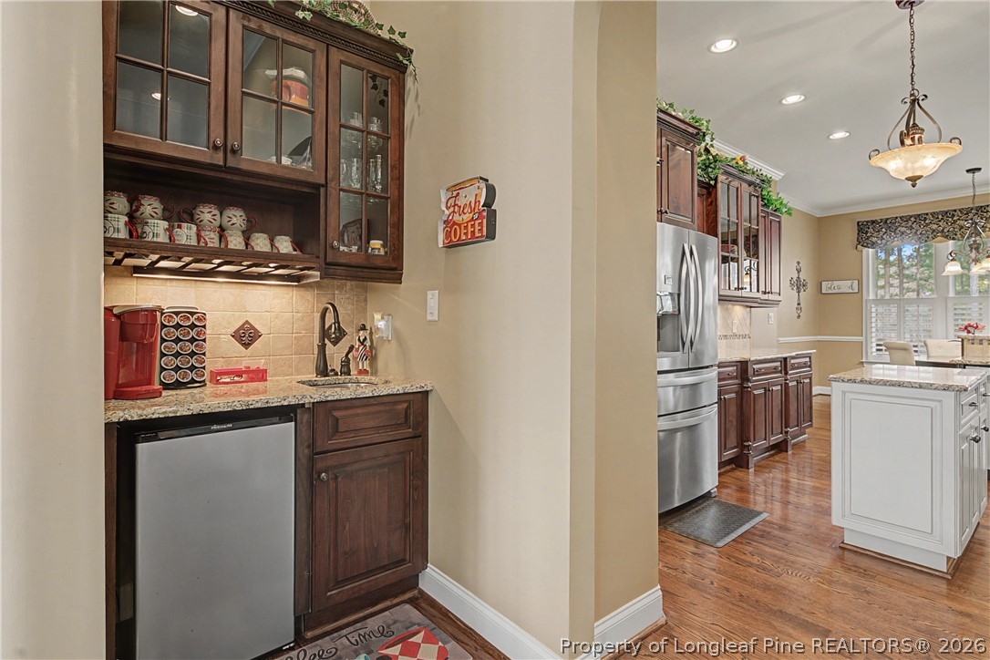 115 Micahs Way North Spring Lake, NC 28390 - Photo 13 of 39 a kitchen with stainless steel appliances granite countertop a refrigerator and a stove