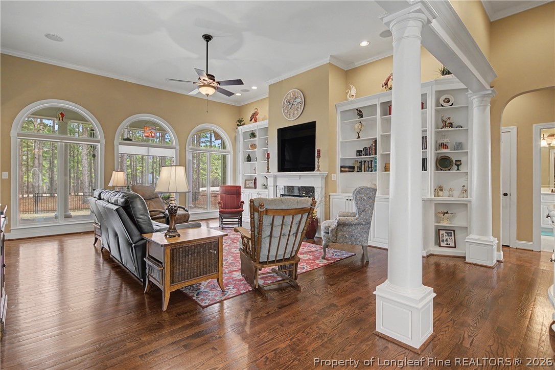 115 Micahs Way North Spring Lake, NC 28390 - Photo 14 of 39 a living room with fireplace furniture and a wooden floor