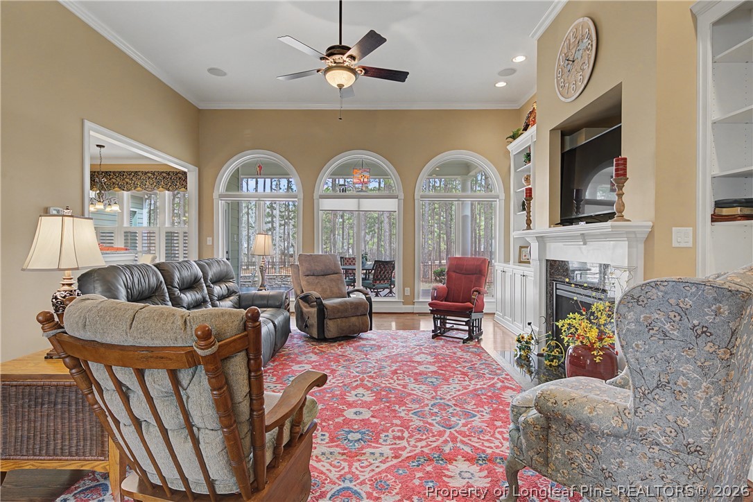 115 Micahs Way North Spring Lake, NC 28390 - Photo 15 of 39 a living room with fireplace furniture and a flat screen tv