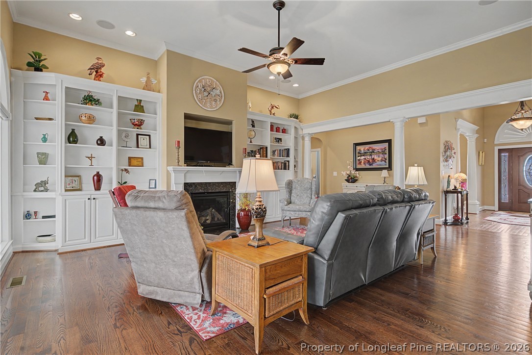 115 Micahs Way North Spring Lake, NC 28390 - Photo 16 of 39 a living room with furniture a fireplace and a flat screen tv