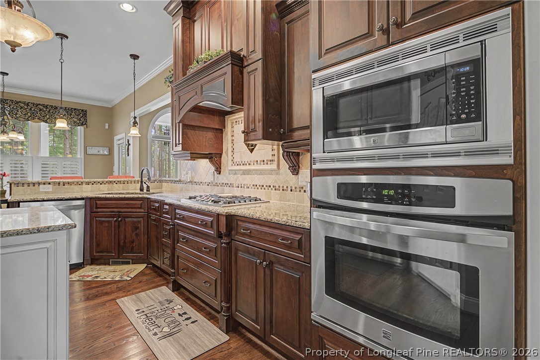 115 Micahs Way North Spring Lake, NC 28390 - Photo 20 of 39 a kitchen with granite countertop stainless steel appliances and cabinets