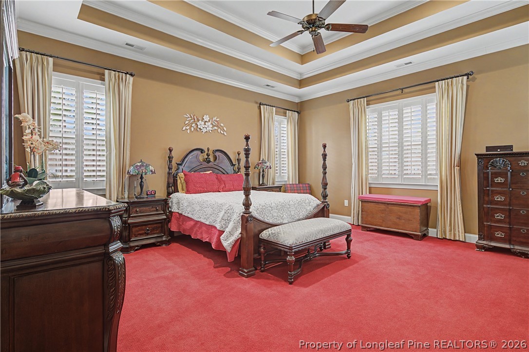 115 Micahs Way North Spring Lake, NC 28390 - Photo 22 of 39 a spacious bedroom with a bed and a couch